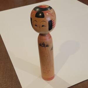 Vintage wooden 9.25 inches tall Japanese Kokeshi doll.